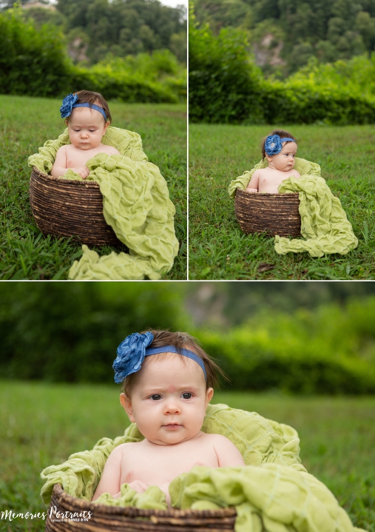 3 month old baby girl outside portraits in brown basket with green blanket on green grass