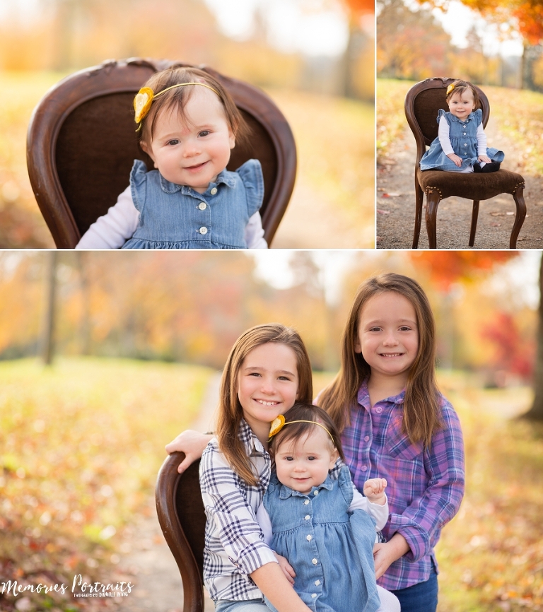 6 month old baby girl with her two sisters surrounded by colorful fall leaves