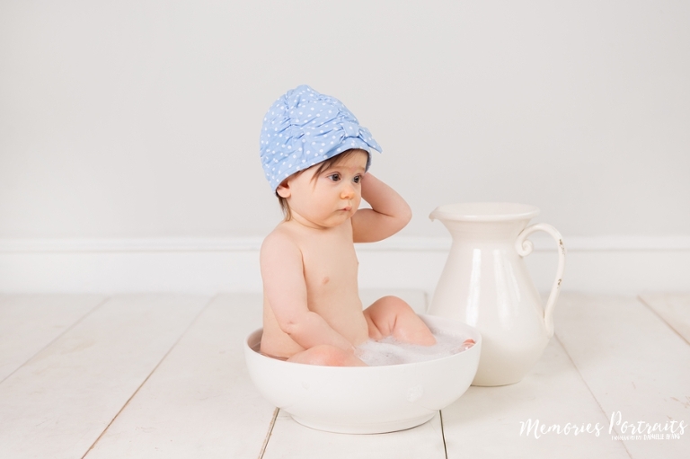 9 month old baby girl in washbowl