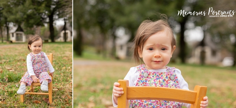 9 month old baby girl outside in park on wooden chair